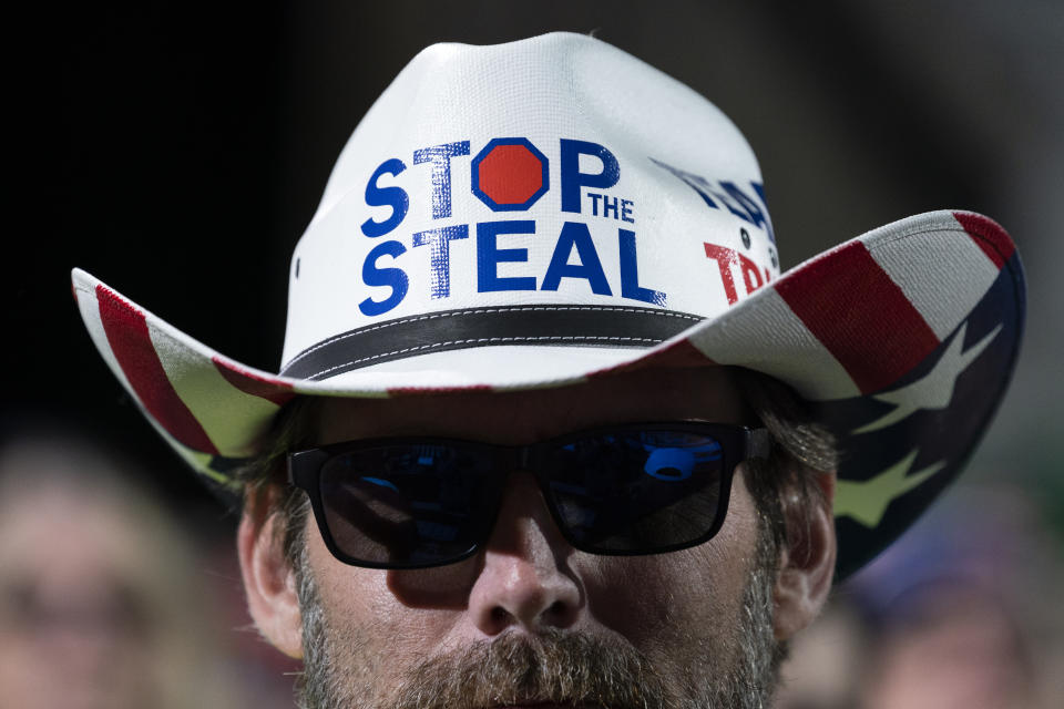 A supporter of President Donald Trump listens to him speak during a campaign rally at Valdosta Regional Airport on Dec. 5, 2020, in Valdosta, Ga. (Evan Vucci/AP)                                                                                                                                                                                                                                                                                                                   