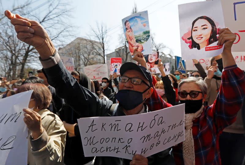 People attend a rally in front of Kyrgyzstan's interior ministry in Bishkek