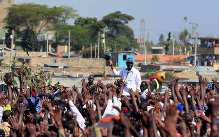 Kenyan opposition leader Raila Odinga, the presidential candidate of the National Super Alliance (NASA) coalition waves to his supporters as he arrives for a rally at the Jacaranda grounds in Nairobi, Kenya September 17, 2017. REUTERS/Thomas Mukoya