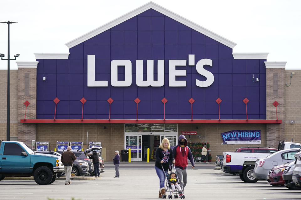 File - Shoppers walk in the lot of a Lowe's home improvement store in Philadelphia, Wednesday, Nov. 17, 2021. On Wednesday, the Conference Board reports on U.S. consumer confidence for May. By Matt Ott. UPCOMING: 130 words after release of report at 10 a.m., then expanded.(AP Photo/Matt Rourke, File)