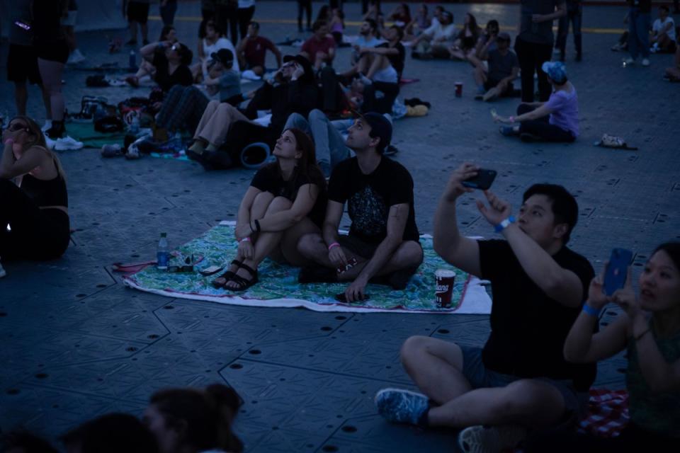 Visitors watch the solar eclipse move into totality during an eclipse viewing event in Bloomington, Ind.<span class="copyright">Chet Strange—Bloomberg/Getty Images</span>