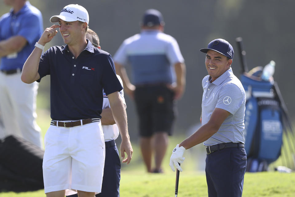 Justin Thomas, left, shares a laugh with Rickie Fowler as they prepare to play a practice round for the Tour Championship golf tournament in Atlanta, Wednesday, Aug. 21, 2019. (Curtis Compton/Atlanta Journal-Constitution via AP)