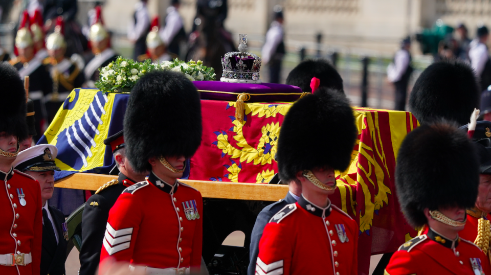 A crown was placed on a purple cushion on top of the coffin which glistened in the afternoon sunshine. (PA)