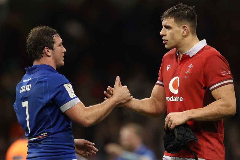 Wales captain Dafydd Jenkins shakes hands with Italy captain Michele Lamaro -Credit:Michael Steele/Getty Images