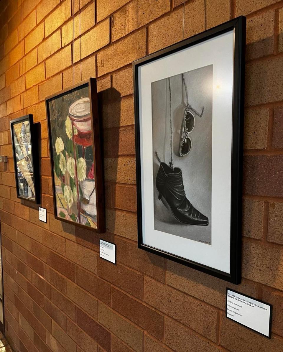 Artwork by those recognized for Art Educator of the Year in Stark County is on display at the Canton Museum of Art. At far right is the charcoal art piece submitted by Hoover High School art teacher Tam Grandjean of Hoover High School. Grandjean was named Art Educator of the Year.