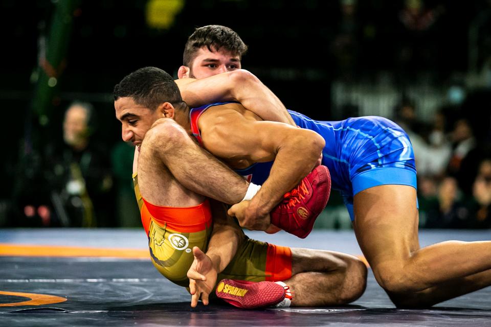 Rahman Amouzadhalili of Iran, right, wrestles Yianni Diakomihalis of the United States at 65 kg during championship finals of the United World Wrestling men's freestyle World Cup on Sunday.