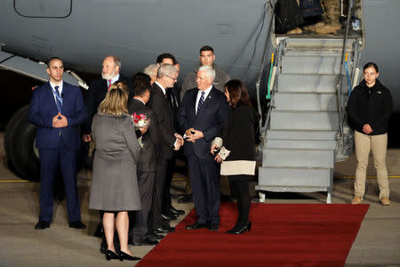 U.S. Vice President Mike Pence (C) and his wife Karen meet officials upon their arrival at Ben Gurion international Airport in Lod, near Tel Aviv, Israel January 21, 2018. REUTERS/Ammar Awad