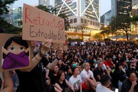 People attend a rally in support of demonstrators protesting against proposed extradition bill with China, in Hong Kong