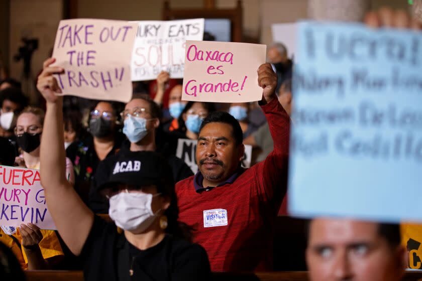 LOS ANGELES, CA - OCTOBER 11: Protestors at the Los Angeles City Council meeting in the Council Chamber at Los Angeles City Hall on Tuesday, Oct. 11, 2022 in Los Angeles, CA. Protestors want the resignation of Los Angeles Councilmembers Nury Martinez, Kevin de Leon and Gil Cedillo. Martinez made racist remarks about Councilmember Mike Bonin son in the recording as her colleagues, Councilmembers Kevin de Leon and Gill Cedillo, laughed and made wisecracks. (Gary Coronado / Los Angeles Times)