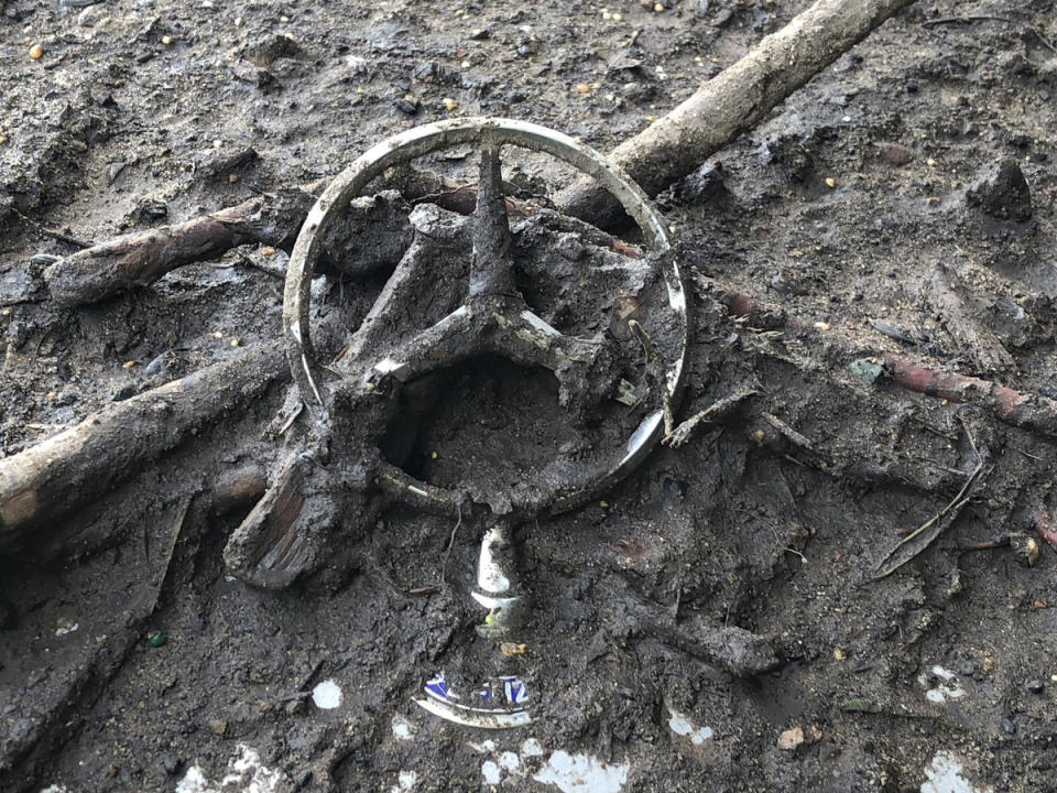 <p>A detail of a Mercedes-Benz hood ornament stuck in the mud after the vehicle was washed away and destroyed by flood waters in Montecito, Calif. on Tuesday, Jan. 9, 2018. (Photo: Mike Eliason/Santa Barbara County Fire Department via AP) </p>