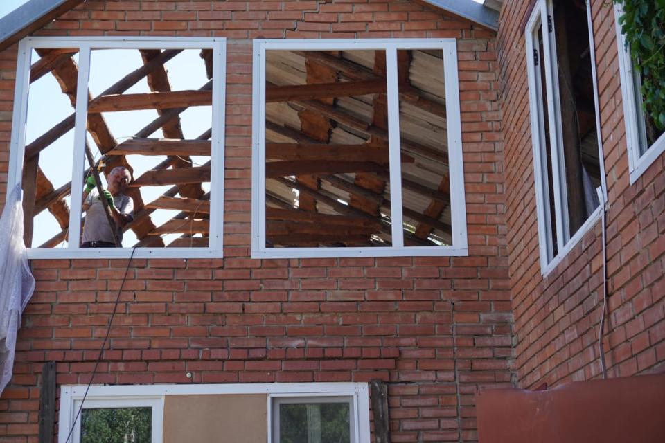 <div class="inline-image__caption"><p>Locals help each other repair a house that was damaged by the missile attack.</p></div> <div class="inline-image__credit">Stefan Weichert</div>