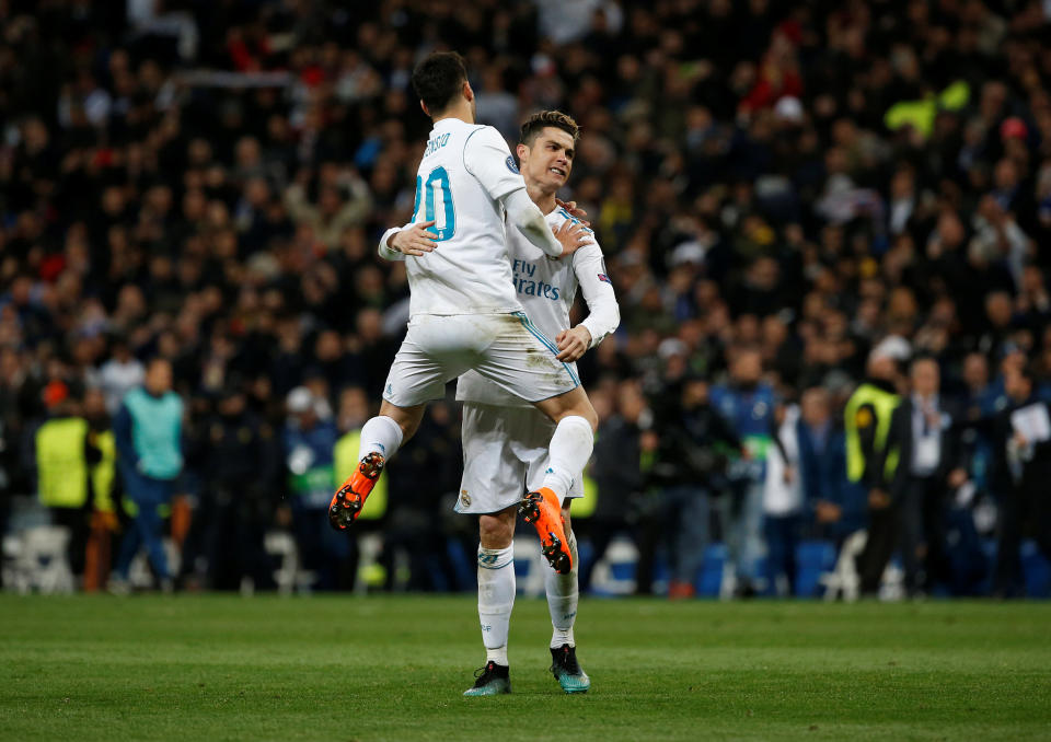 <p>Soccer Football – Champions League Quarter Final Second Leg – Real Madrid vs Juventus – Santiago Bernabeu, Madrid, Spain – April 11, 2018 Real Madrid’s Cristiano Ronaldo celebrates with Marco Asensio after the match REUTERS/Stringer </p>