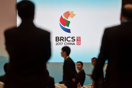 Delegates arrive prior to the opening ceremony of the BRICS Business Forum in Xiamen, China September 3, 2017. REUTERS/Fred Dufour/Pool