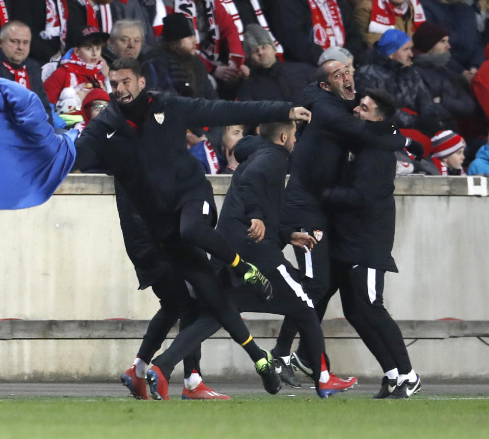 Sevilla team members celebrate after scoring their third goal during their Europa League Round of 16 second leg soccer match between Slavia Praha and Sevilla at the Sinobo stadium in Prague, Czech Republic, Thursday, March 14, 2019. (AP Photo/Petr David Josek)