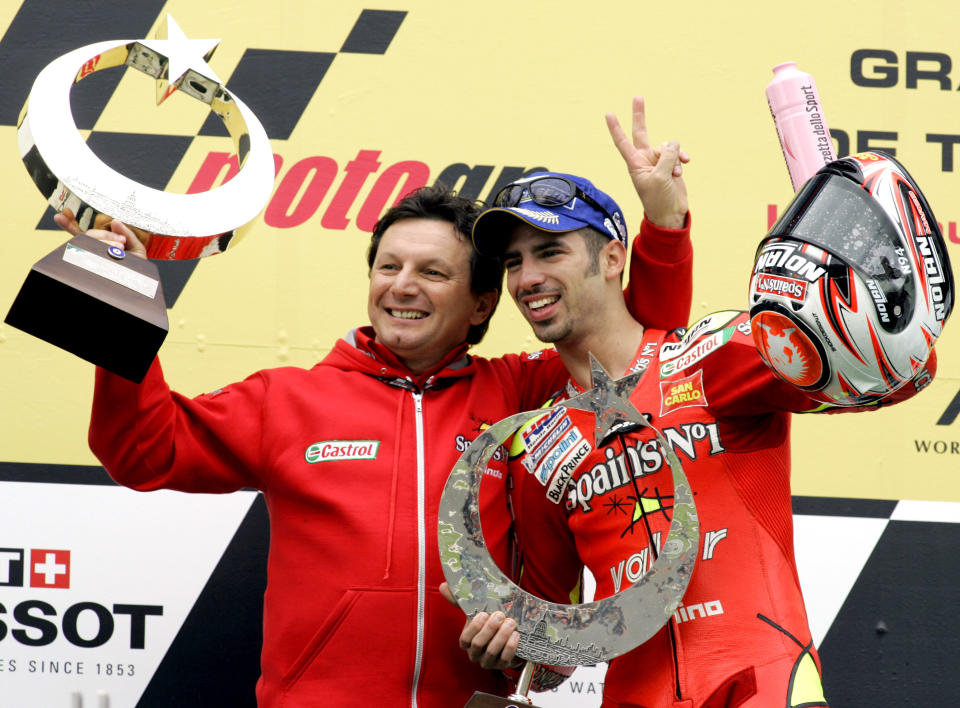 <p>Fortuna Honda Team Moto GP rider Marco Melandri of Italy celebrates with his team manager Fausto Gresini, left, at the Istanbul Park race track in Istanbul, Turkey, Sunday, April 30, 2006, during a ceremony at the end of the MotoGP Turkish Grand Prix. Marco Melandri of Italy won the Turkish Grand Prix in Istanbul, displaying his mastery of a course he also won last year. Melandri passed Moto GP rookie Casey Stoner of Australia on the last lap. (AP Photo/Murad Sezer)</p> 