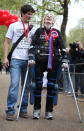 LONDON, ENGLAND - MAY 08: Claire Lomas stands with her husband Dan Spincer (L) after crossing the finishing line of the Virgin London Marathon on May 8, 2012 in London, England. Ms Lomas, who is paralysed from the waist down after a riding accident in 2007, has taken 16 days to complete the 26.2 mile route. Starting out with 36,000 other runners she has averaged 2 miles a day with the help of a bionic ReWalk suit. (Photo by Peter Macdiarmid/Getty Images)