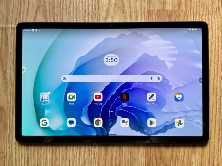 Lenovo Tab P11 Pro Gen 2 on wood floor with home screen open