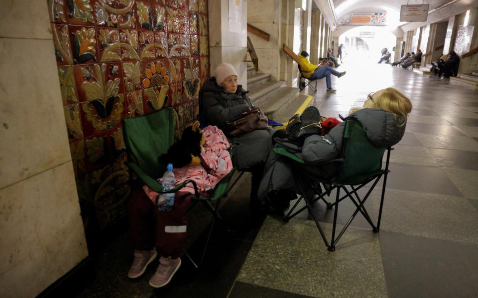 People take shelter in a Kyiv metro station during a Russian missile strike.