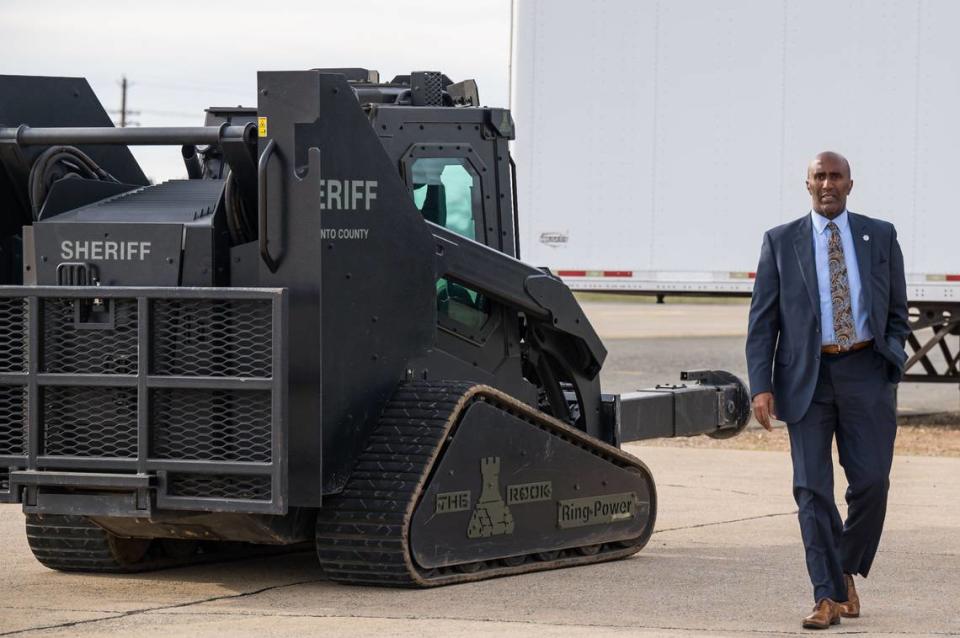 Sacramento County Sheriff Jim Cooper walks past the department’s Rook - configured with an hydraulic breaching ram attachment on the front - on Thursday, Feb. 16, 2023, before SWAT team members demonstrate the vehicle at their facility in Sacramento County. Xavier Mascareñas/xmascarenas@sacbee.com