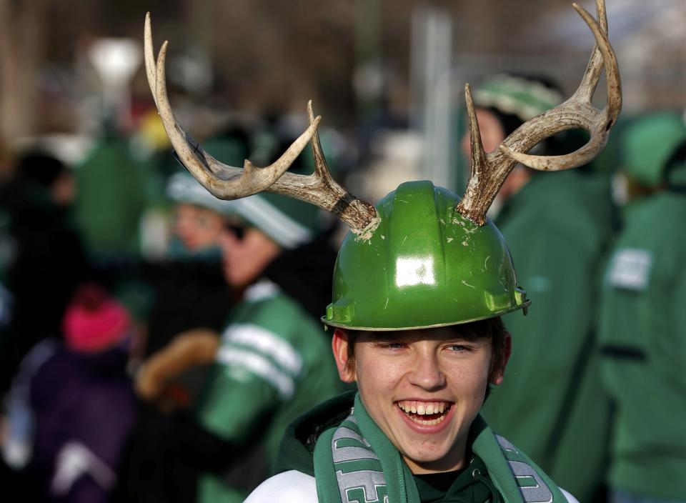 Fan Alexei Bashutsky sports antlers on his helmet prior to 101st Grey Cup game championship football game in Regina