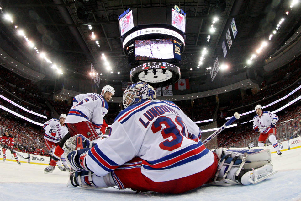 NEWARK, NJ - MAY 25: Henrik Lundqvist #30 of the New York Rangers makes a save against the New Jersey Devils in Game Six of the Eastern Conference Final during the 2012 NHL Stanley Cup Playoffs at the Prudential Center on May 25, 2012 in Newark, New Jersey. (Photo by Jim McIsaac/Getty Images)