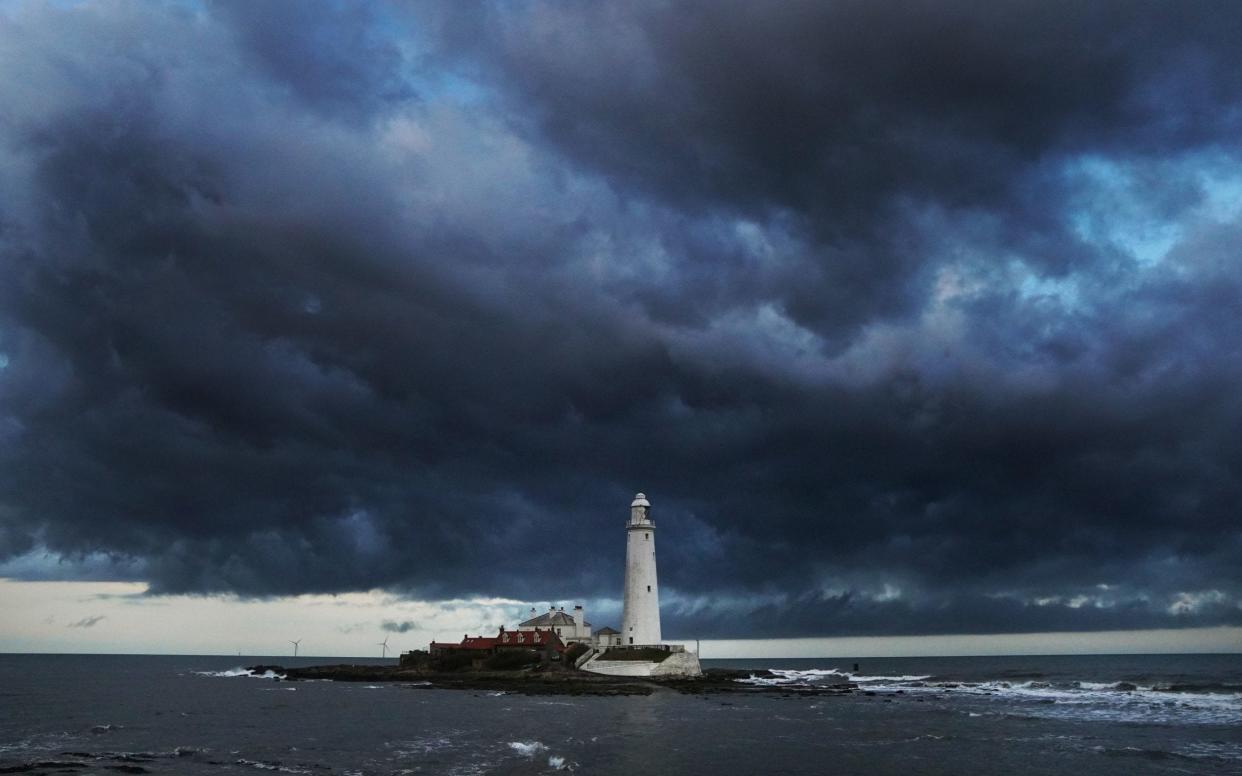 Clouds form over St Marys Lighthouse in Whitley Bay as Storm Hannah approaches Britain - PA