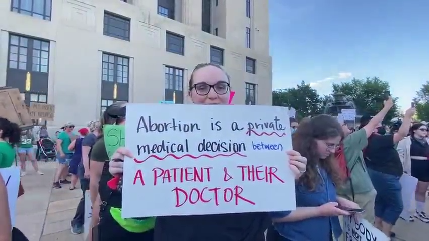 A protester holds up a sign during a march for abortion rights in Nashville in June. Tennessee's no-exceptions abortion law puts each physician who performs an abortion to reduce the risk of a serious medical complication or to save the life of the mother at risk of criminal liability.