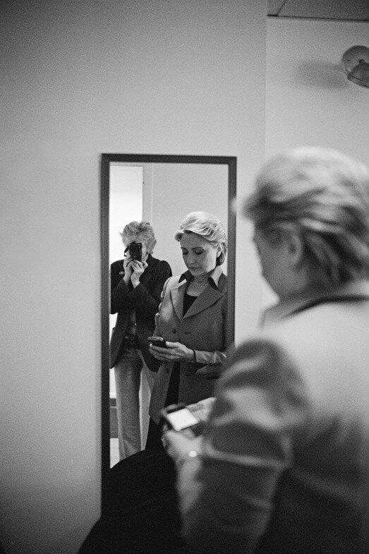 Before an appearance with David Letterman, Hillary checks her BlackBerry while Diana Walker takes their picture. Feb. 4, 2008.