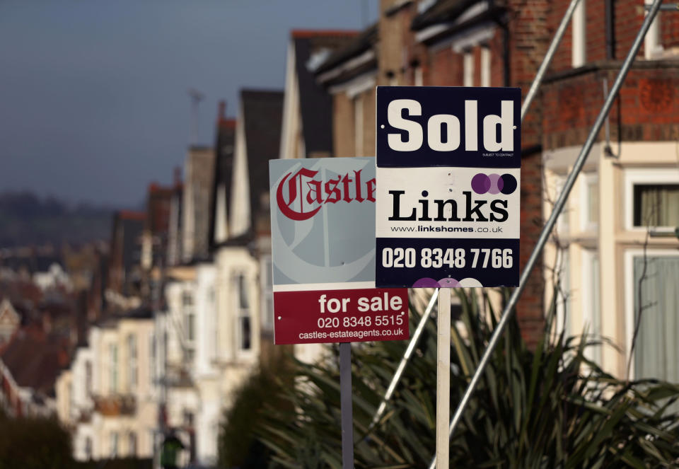 File photo dated 23/01/15 of estate agents signs outside houses. House prices ended 2019 1.4% higher than when the year started, according to an index.