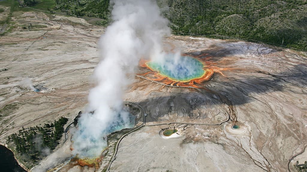  Hot springs at Yellowstone National Park give off plumes of steam. 
