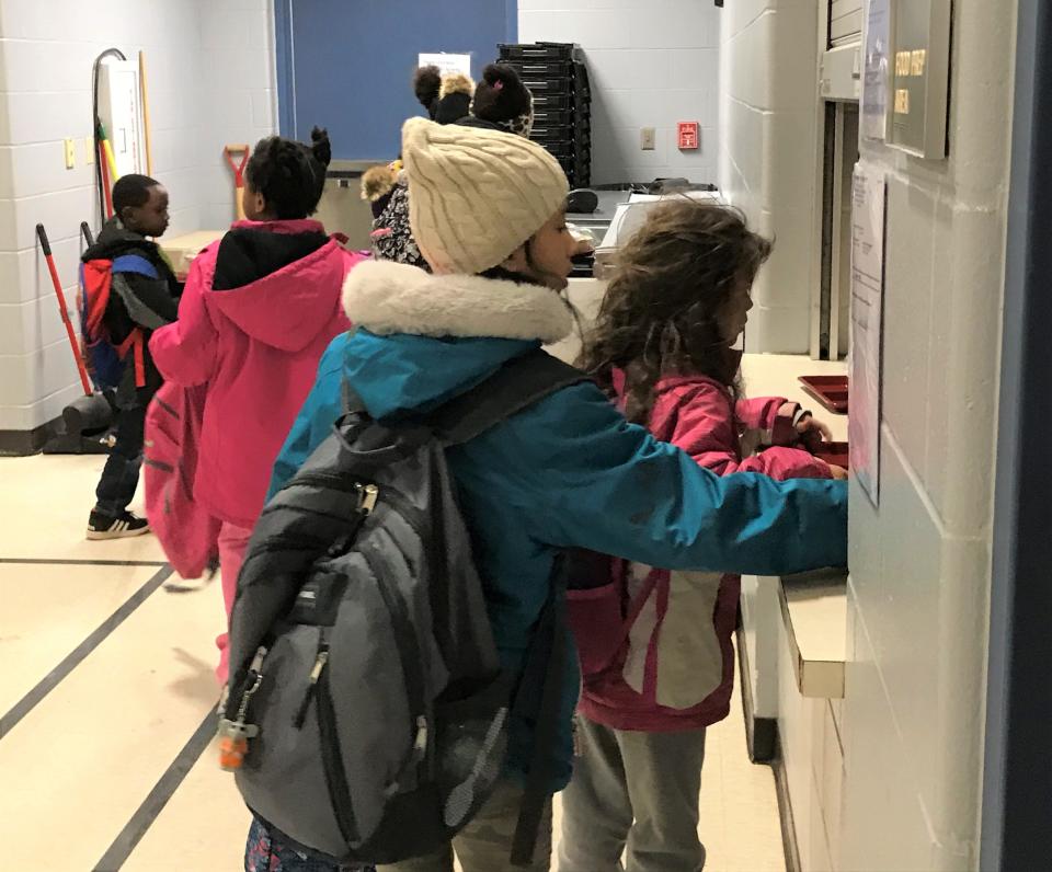 Laura B. Anderson students line up for breakfast in the school's gym at 7:30 a.m., before classes start, on Dec. 16, 2019.