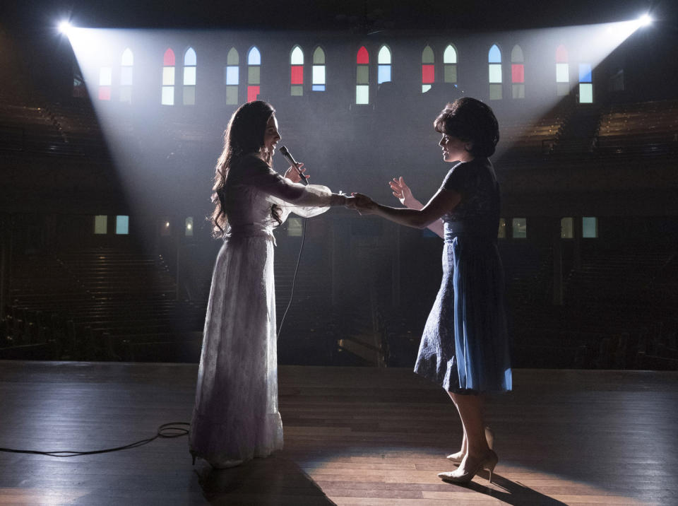 This image released by Lifetime shows Jessie Mueller as Loretta Lynn, left, and Megan Hilty as Patsy Cline in a scene from the TV film, "Patsy & Loretta." The film airs on Oct. 19 on Lifetime. (Jake Giles Netter/Lifetime via AP)