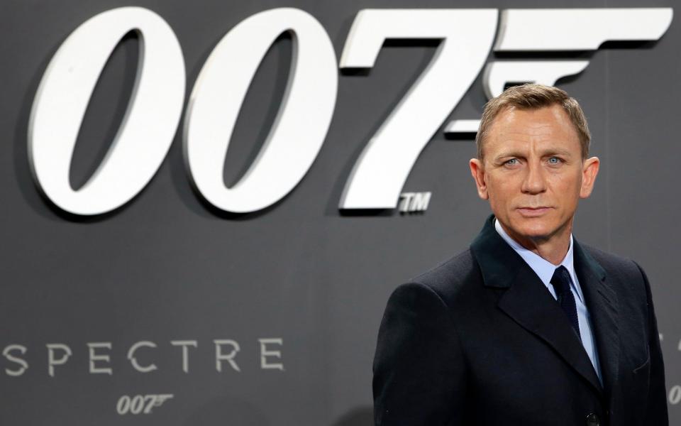 Daniel Craig poses for the media as he arrives for the German premiere of the James Bond movie 'Spectre' in Berlin - Michael Sohn/AP