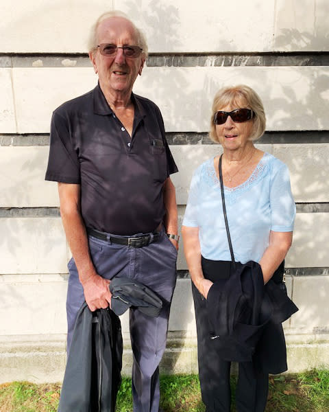 Les Halton, 79, and wife, Jo Halton, 78, retirees from Dorset. “He’s very fit, very sharp,” Les said of King Charles. (Corky Siemaszko / NBC News)