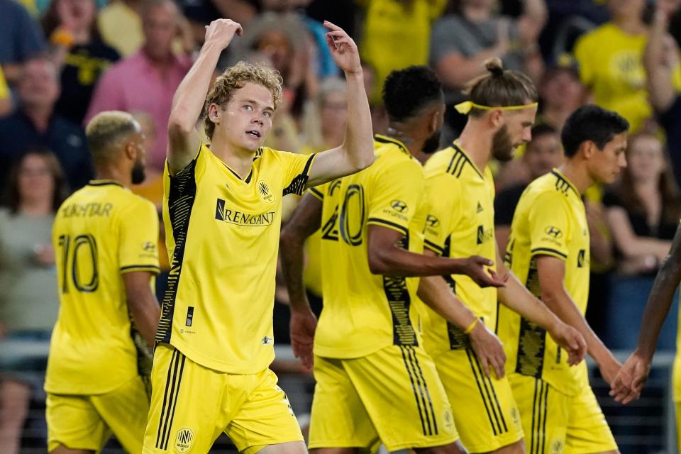 Nashville SC's Jacob Shaffelburg, second from left, celebrates after scoring a goal against the Colorado Rapids during the second half of an MLS soccer match Wednesday, Aug. 31, 2022, in Nashville, Tenn. (AP Photo/Mark Humphrey)