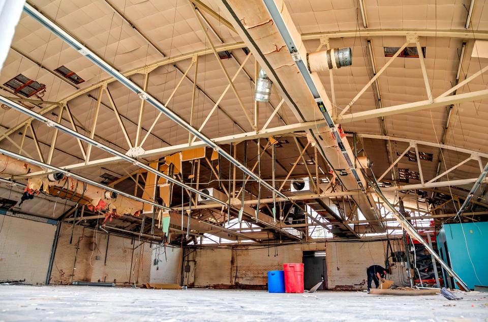 The originally exposed barrel roof of the former Brown's Bakery is visible again after removal of drop-top ceiling tiles.
