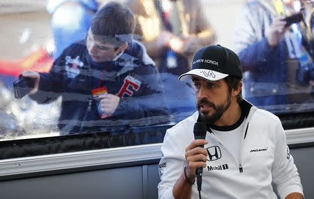 McLaren Formula One driver Fernando Alonso of Spain attends to a news conference during pre-season testing at the Jerez racetrack in southern Spain February 1, 2015. REUTERS/Marcelo del Pozo