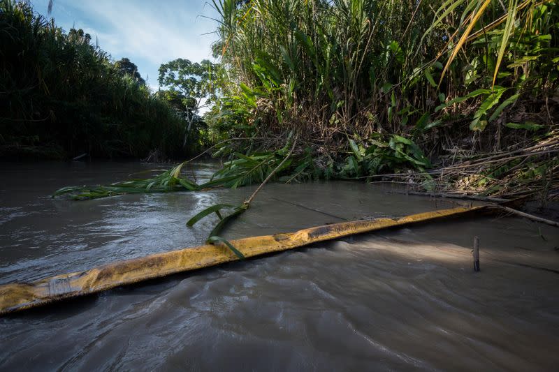 Traces of crude oil from a pipeline are seen on the banks of the Napo River in the Ecuadorian Amazon