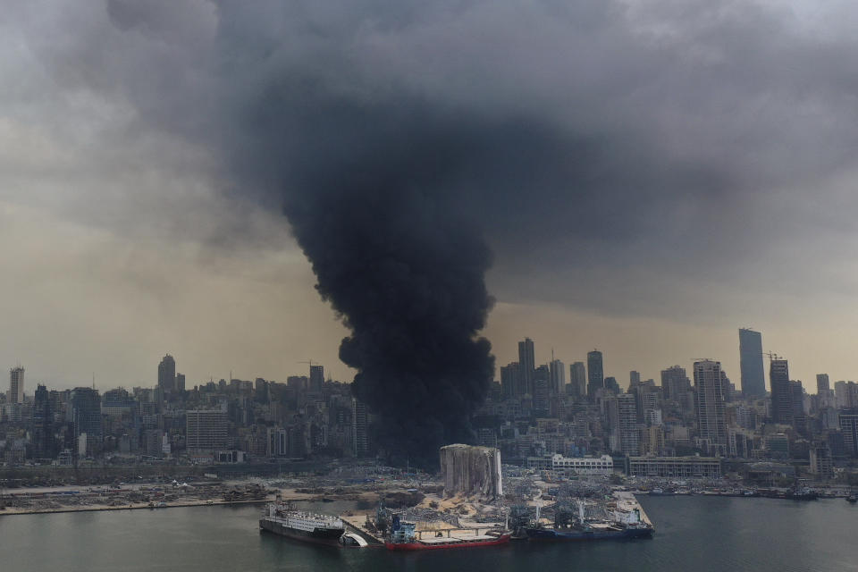 FILE - Black smoke rises from a fire at warehouses at the seaport of Beirut, Lebanon, Thursday, Sept. 10. 2020. Three years after Beirut’s massive port blast, attempts to prosecute those responsible are mired in political intrigue, the final death toll remains disputed and many Lebanese have less faith than ever in their disintegrating state institutions. As the country marks the anniversary Friday, Aug. 4, 2023, relatives of some of those killed are still struggling to get their loved ones recognized as blast victims, reflecting the ongoing chaos since the Aug. 4, 2020 explosion. (AP Photo/Hussein Malla, File)