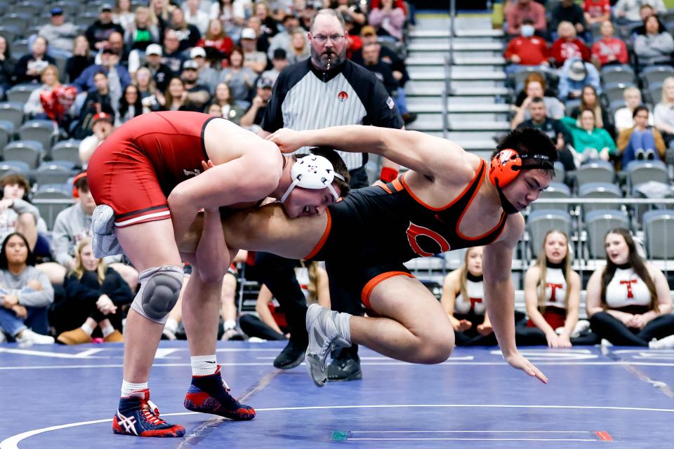 Tuttle’s Cody Abston (left) takes down Cushing’s Michael Cruz (right) during the 4A State Championship Team Wrestling Dual between Tuttle and Cushing at the Stride Bank Center in Enid, Okla., on Friday, Feb. 9, 2024.