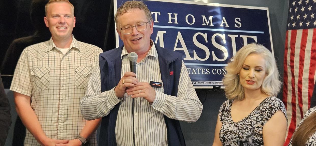 Thomas Massie(Center) gives a victory speech at PeeWee's Place in Northern Kentucky on Tuesday