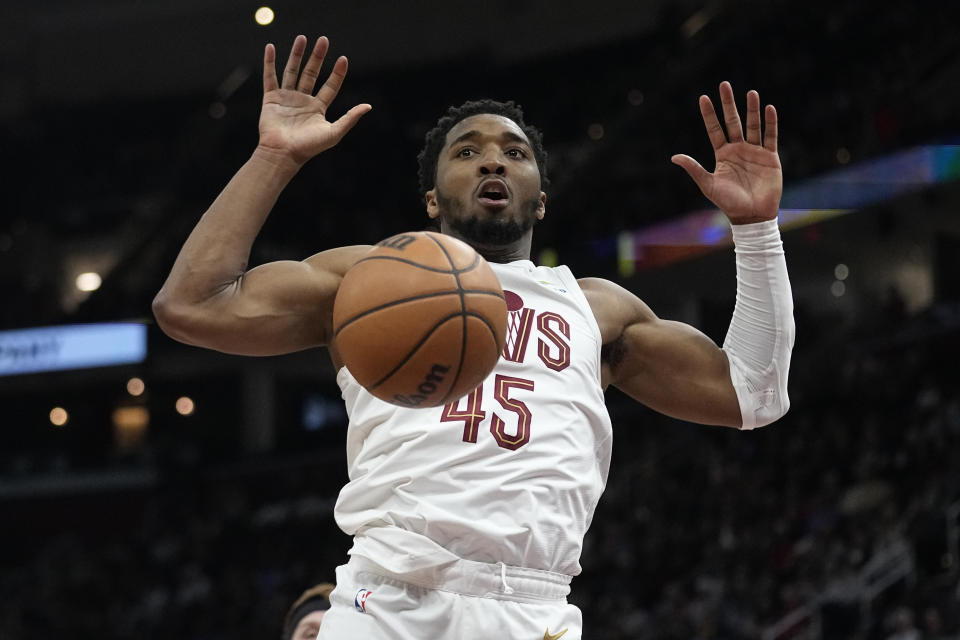 Cleveland Cavaliers guard Donovan Mitchell dunks in the second half of an NBA basketball game against the Sacramento Kings, Monday, Feb. 5, 2024, in Cleveland. (AP Photo/Sue Ogrocki)