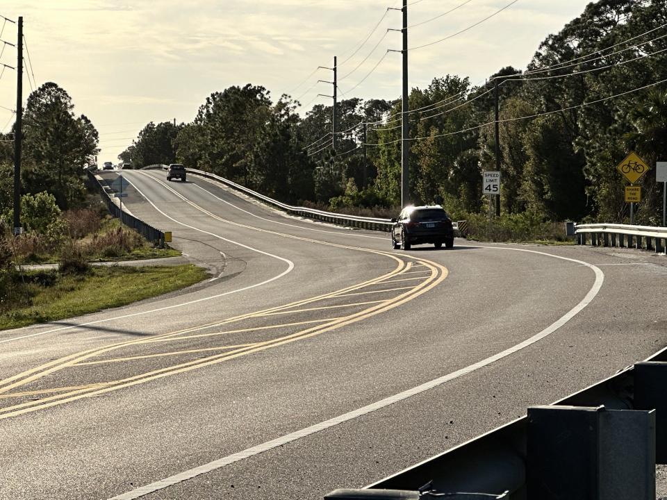 Cars traverse Pioneer Trail heading west on a bridge over Interstate 95 Tuesday. The Florida Department of Transportation want to construct a new interchange at that location.