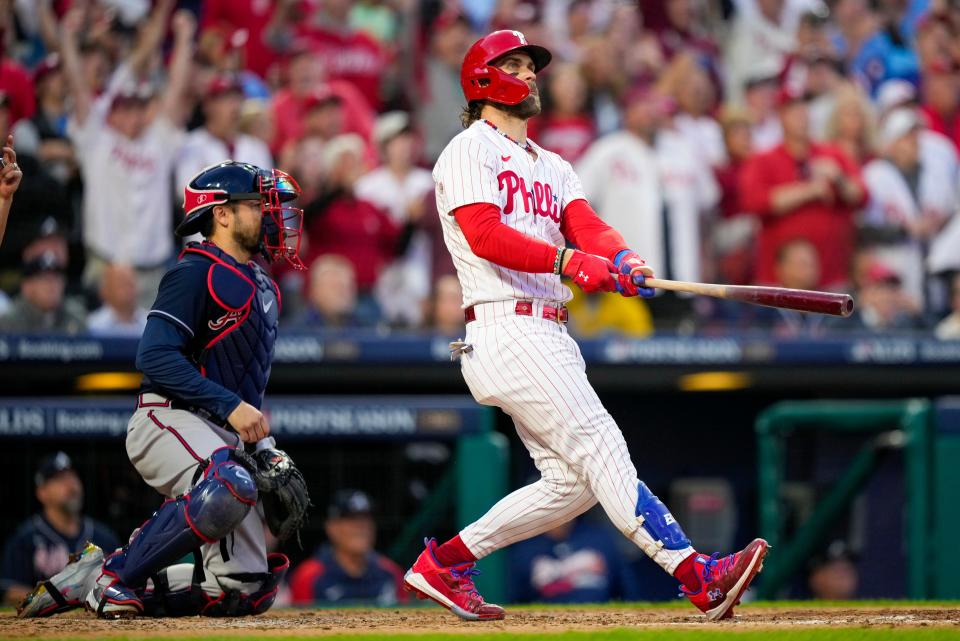 Philadelphia Phillies' Bryce Harper hits a three run home run during the third inning of Game 3 of a baseball NL Division Series against the Atlanta Braves Wednesday, Oct. 11, 2023, in Philadelphia.