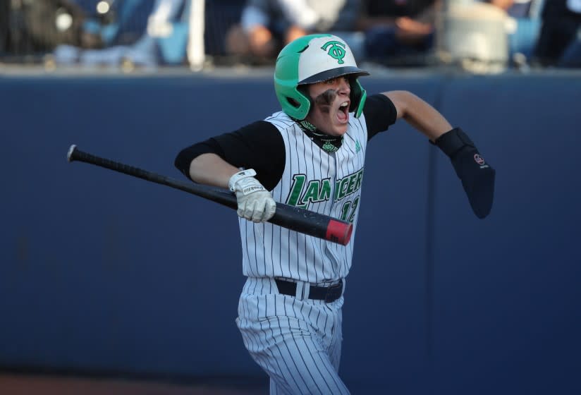 FULLERTON, CA - JUNE 19, 2021: Thousand Oaks Peyton Miller (12) reacts after scoring the tying run against Trabuco Hills in the fifth inning of the CIF Southern Section Division 2 Championship at Cal State Fullerton on June 19, 2021 in Fullerton, California. Thousand Oaks won 3-2.(Gina Ferazzi / Los Angeles Times)