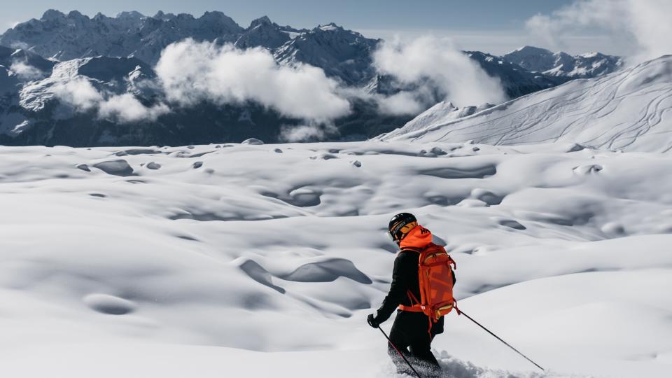 Skier floating through deep powder in Verbier