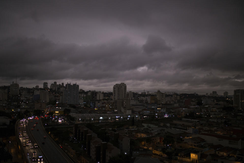 Darkened skies in Sao Paulo, seen on Monday, August 19. Residents of this metropolis of millions recently reported black rain. Studies by two universities confirmed that the rainwater contains fire residues. | Andre Lucas—AP Images