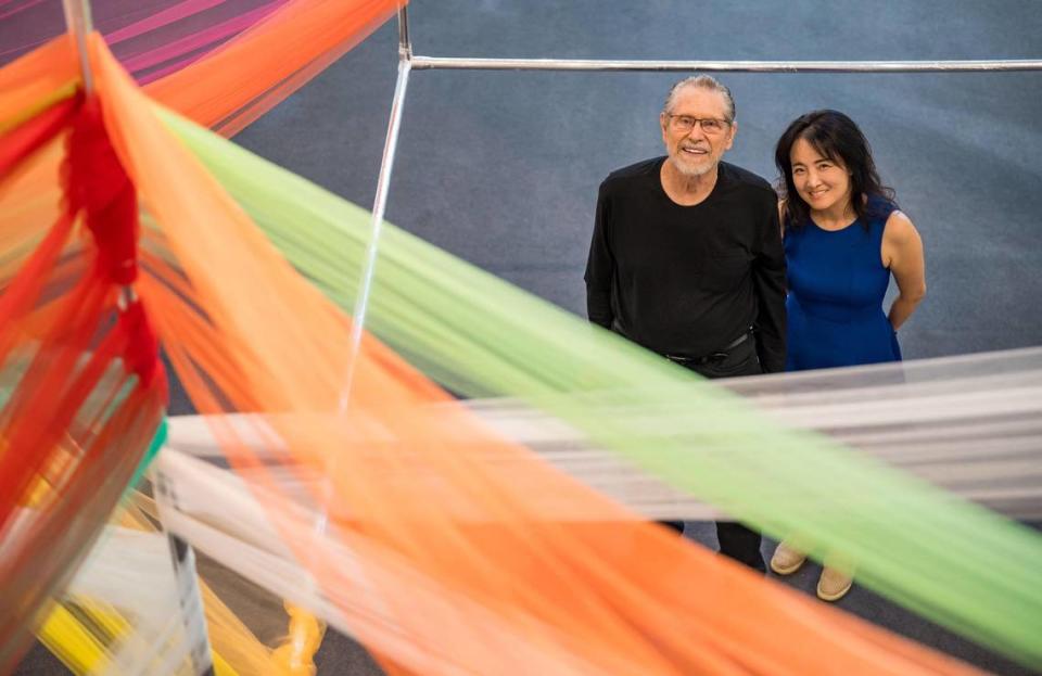 Stephen Kaltenbach, left, a former Sacramento State professor renowned as a sculptor and conceptual artist, and Seongmin Yoo, a Korean-born conceptual and installation artist who later studied with Kaltenbach, stand in their collaboration, “Epicenter” earlier this month at the John Natsoulas Gallery in Davis.