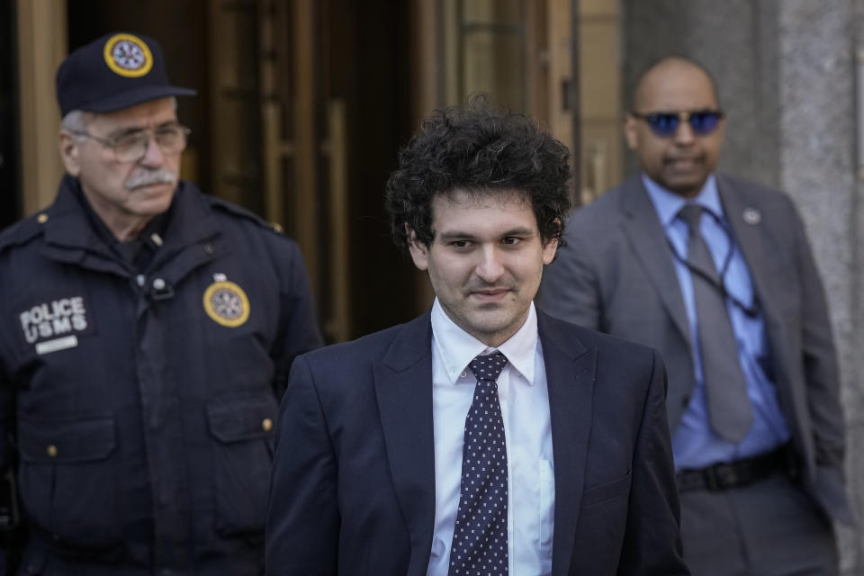 NEW YORK, NY - MARCH 30: FTX founder Sam Bankman-Fried (C) departs Manhattan Federal Court after an arraignment hearing on March 30, 2023 in New York City. Federal prosecutors added a foreign bribery charge to the list of crimes that Bankman-Fried is already facing. The indictment accuses the FTX founder of directing $40 million in bribes to Chinese government officials to unfreeze assets related to his cryptocurrency business. (Photo by Drew Angerer/Getty Images)