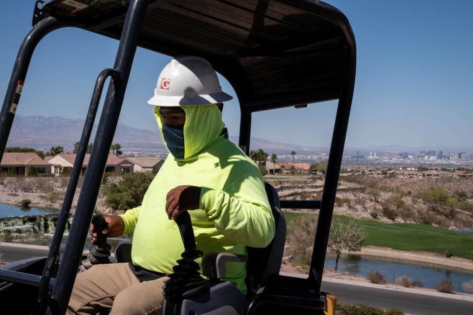 Jose Colorado works on a turf conversion/removal project at the community recreation center in Sun City Anthem in Henderson, Nevada, on Sept. 26, 2022.